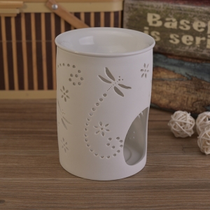 White ceramic candle burner with hellow out pattern