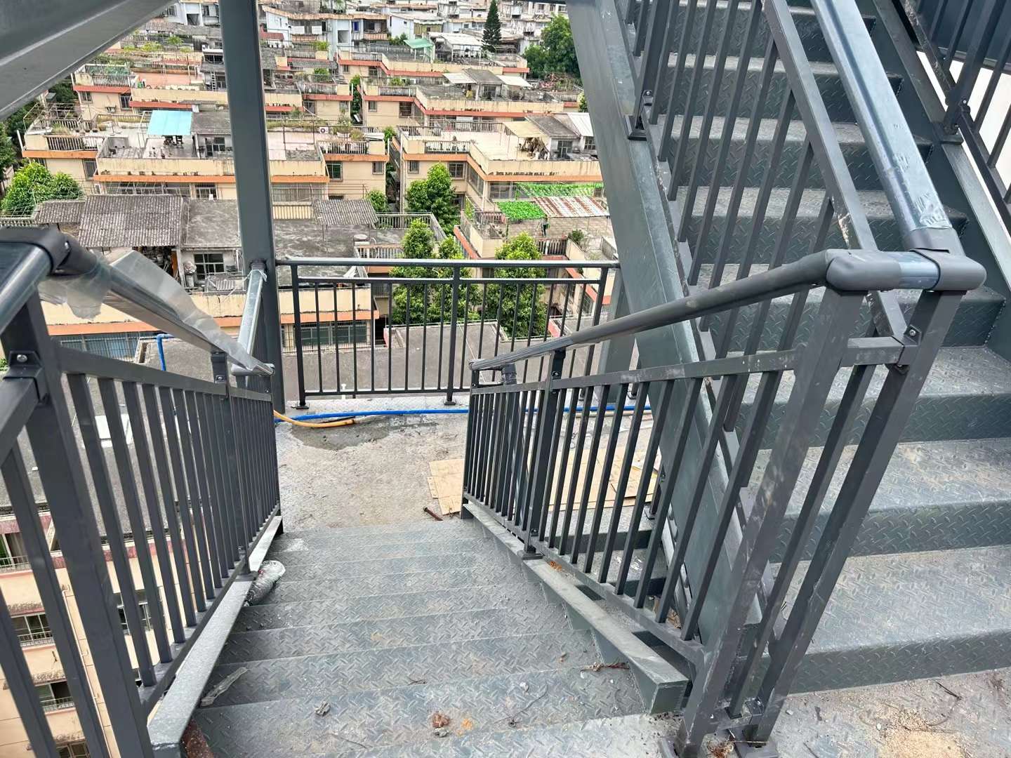 Matte black steel stair handrails