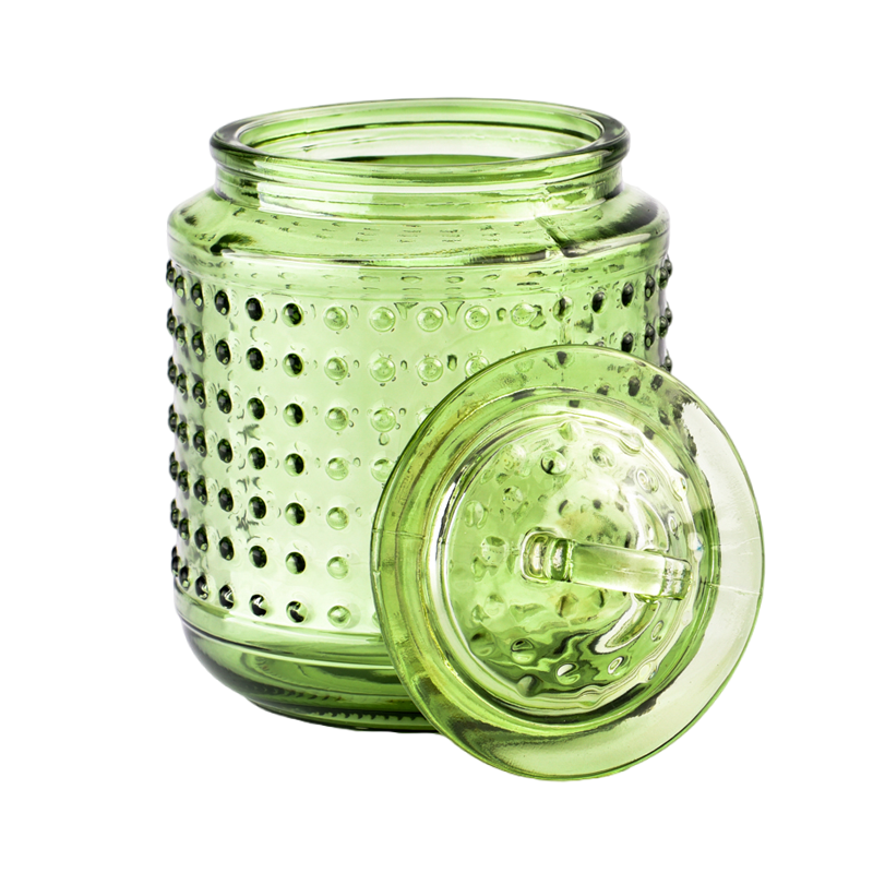 Leeres Kerzenglas mit grünen Punkten im Großhandel mit Deckel