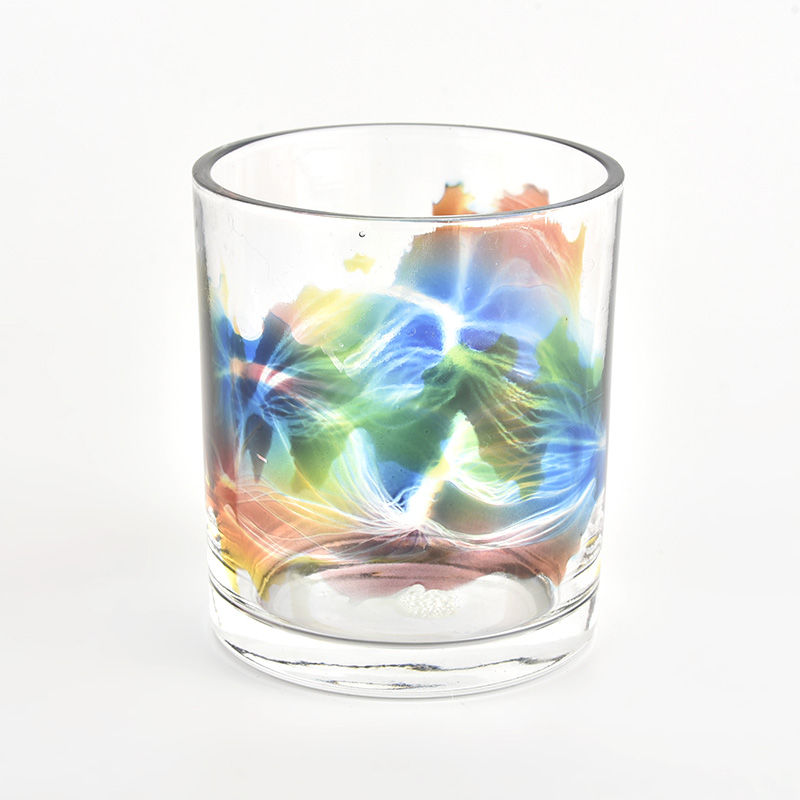 clear glass candle vessel with beautiful painting