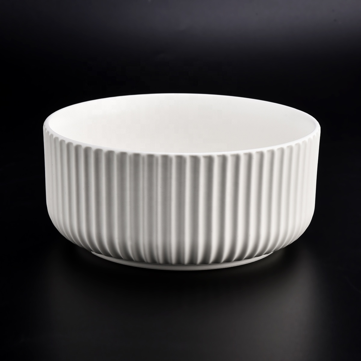 matte white glazed ceramic candle jars with stripe designs