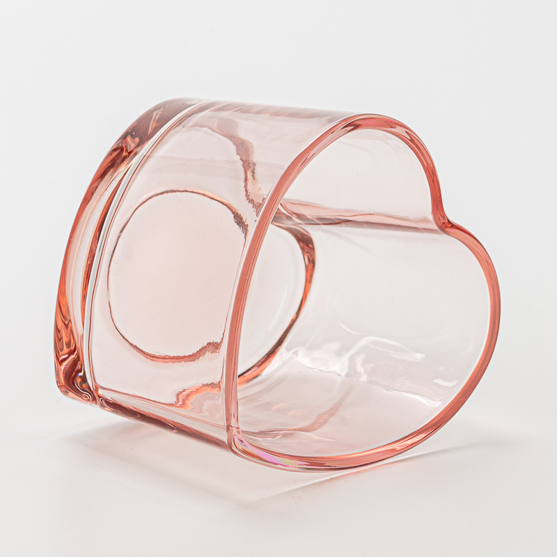 Beliebte rosa Herzformglaskerzenhalter