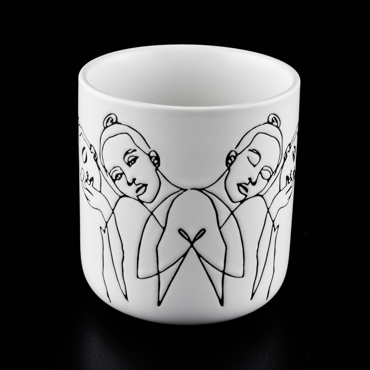 Matte white ceramic candle jars with sketch artwork