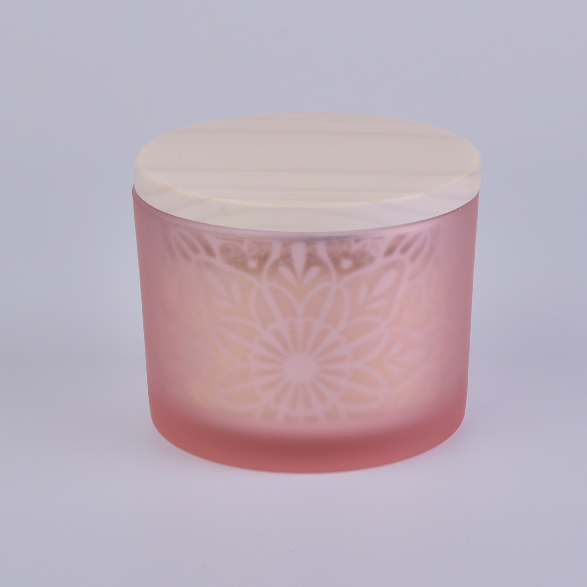 pink glass candle holder with laser pattern and wooden lid