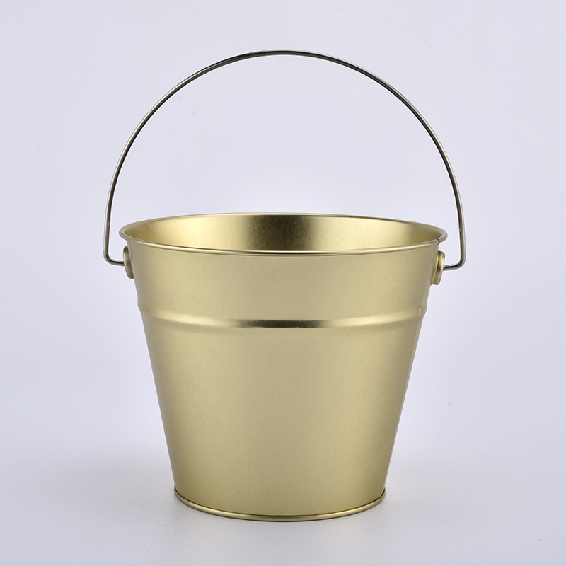large gold metal candle bucket with handle