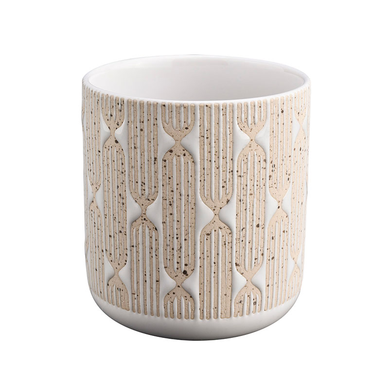 white ceramic candle jar with yellow debossed pattern