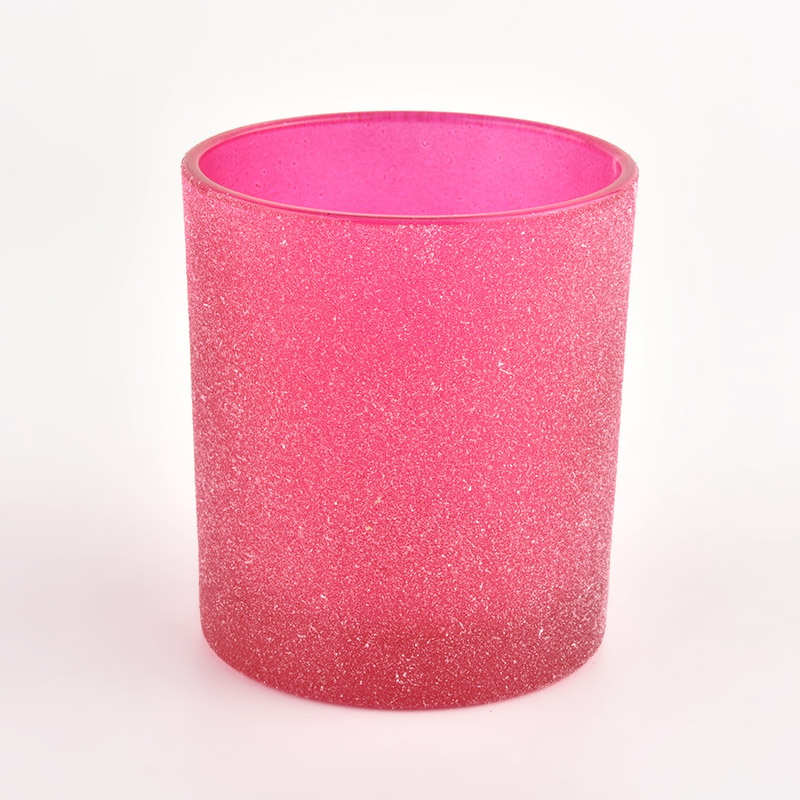 砂のコーティングが施されたピンクのガラスキャンドルジャー
