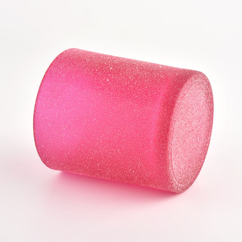 砂のコーティングが施されたピンクのガラスキャンドルジャー