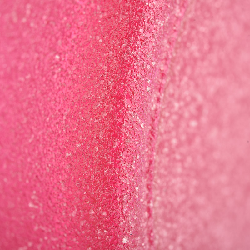 Balang lilin kaca merah jambu dengan salutan pasir
