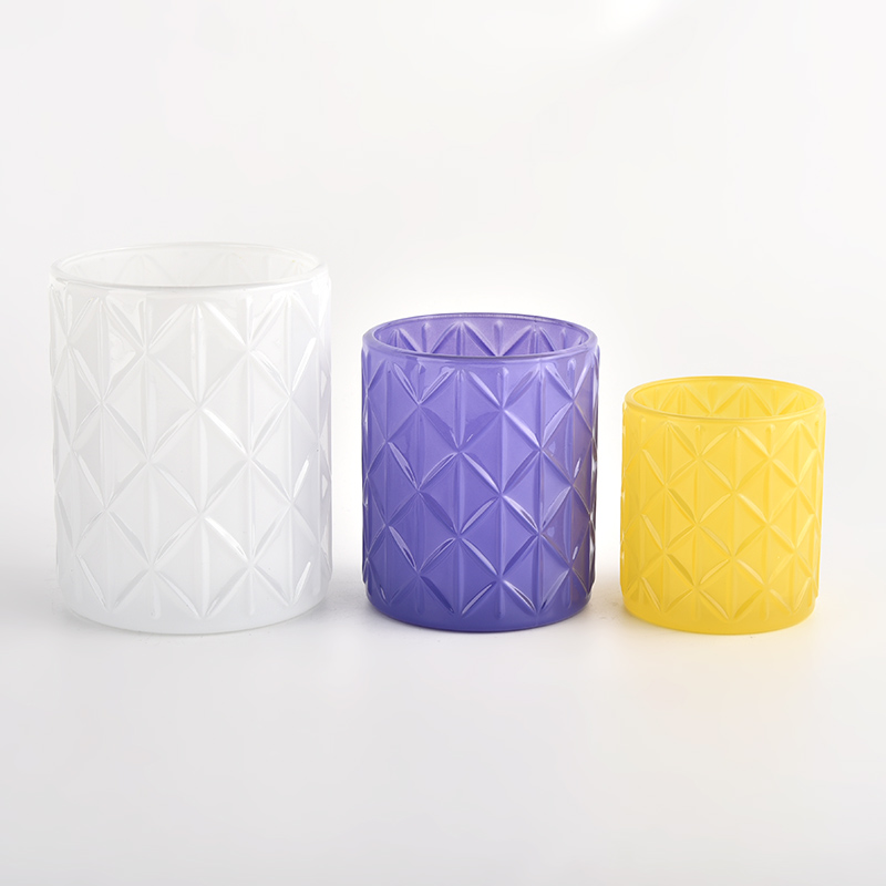 white glass candle vessels with geo cut design