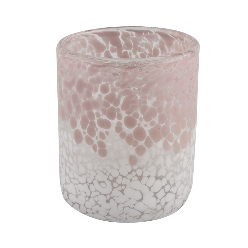 pink og hvid tofarvet glasbeholder til fremstilling af stearinlys