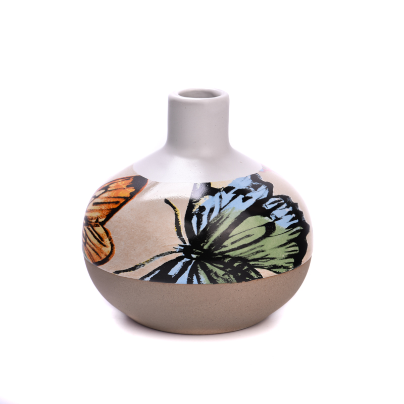 Botellas de aromaterapia de cerámica con patrón de mariposa al por mayor.