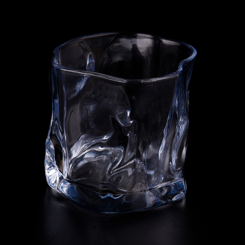 Bicchiere in vetro a forma di spirale. Barattolo per realizzare candele