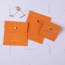 China Bright orange velvet pouch with gold snap manufacturer