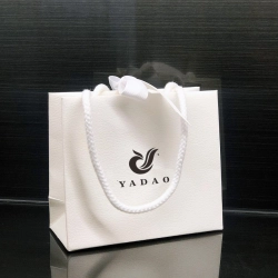 China Yadao gift paper bag with cotton rope and ribbon closure manufacturer