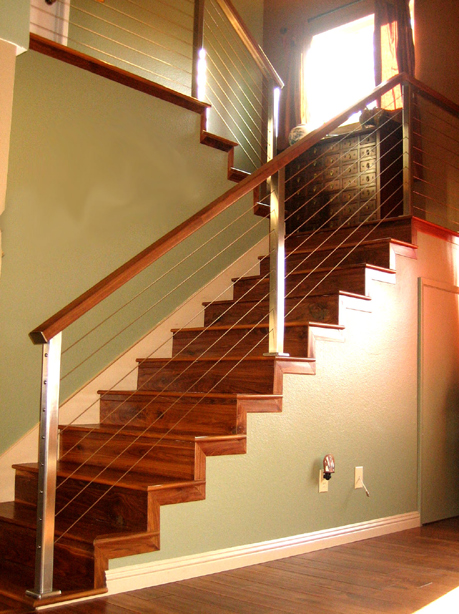 stainless steel staircase cable railing with wood handrails
