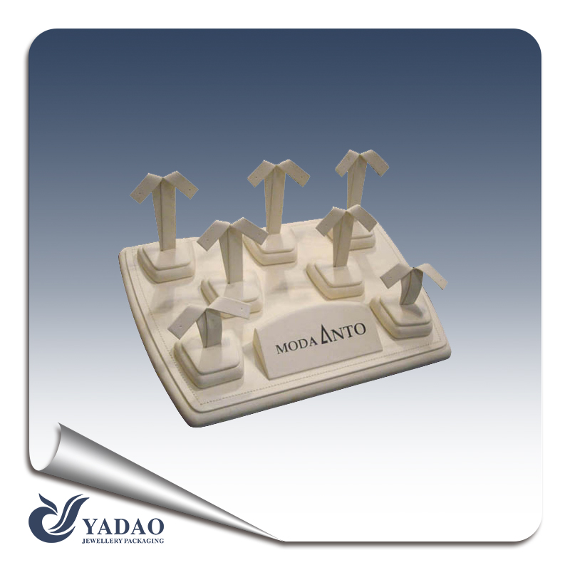 A customized small exquisite earring display set covered with high quality microfiber.