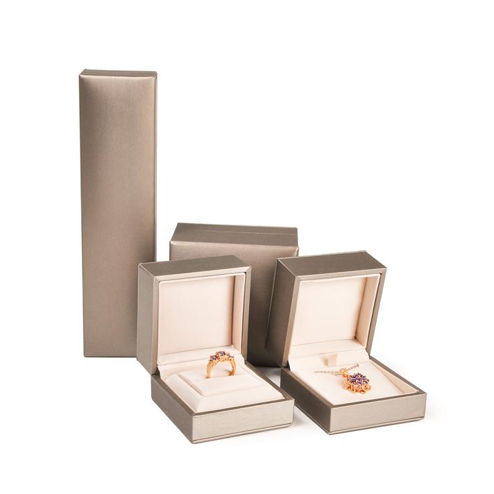 La mayoría populares populares hechos a mano de plástico de cuero sintético caja de joyas conjuntos para anillo, earing, brazalete, collar y colgante
