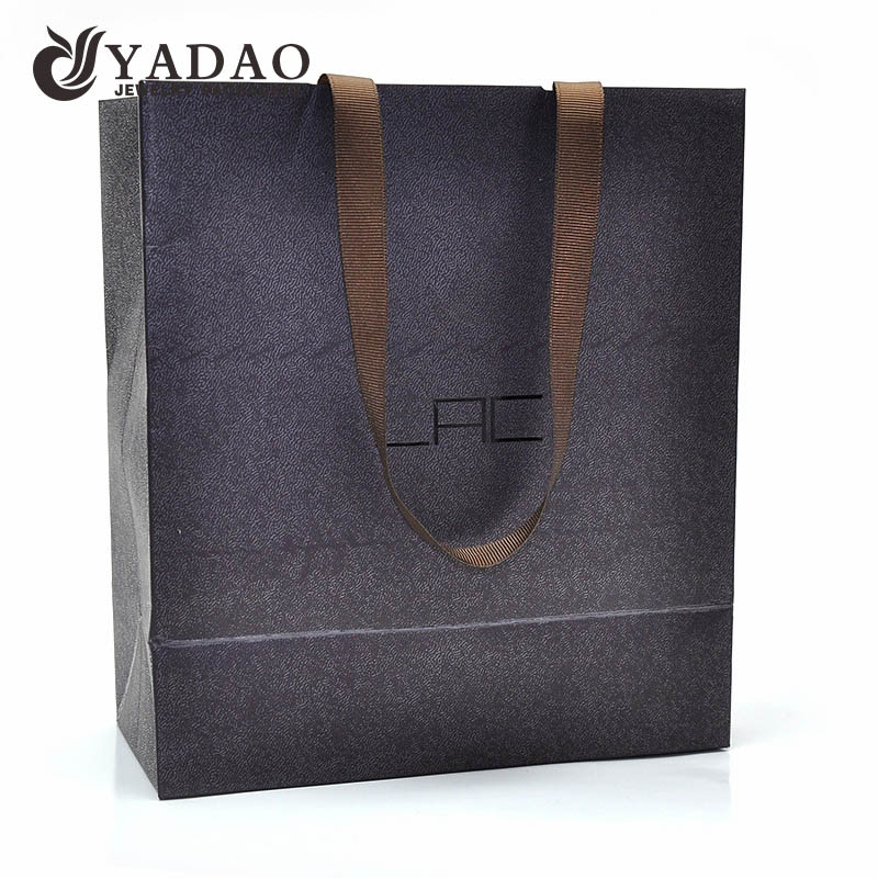 Top quality 210g 230g 250g fancy paper material with texture ribbon handle paper shopping gift bags