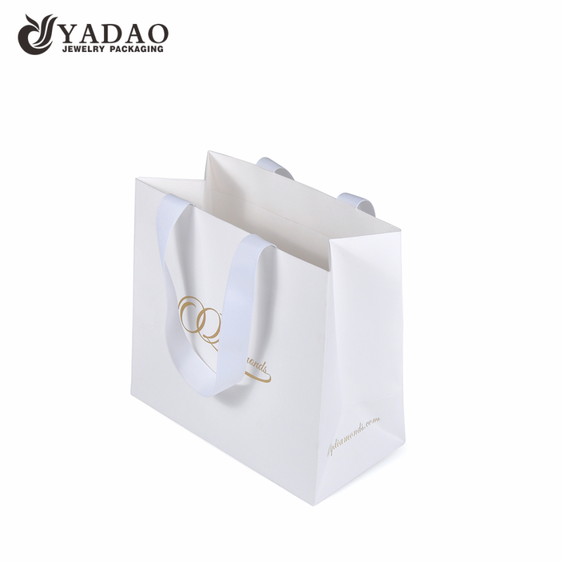 white color fancy textured paper bag gift shopping bag paper jewelry packaging carrying