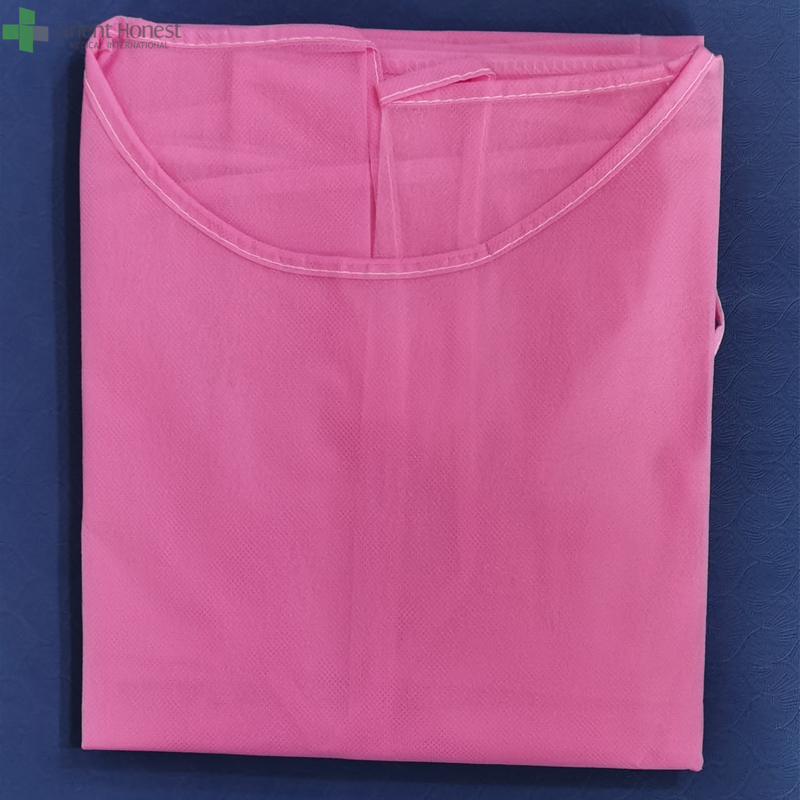 Vestidos de aislamiento desechables rosados, puños de punto no tejidos, 50 / pk