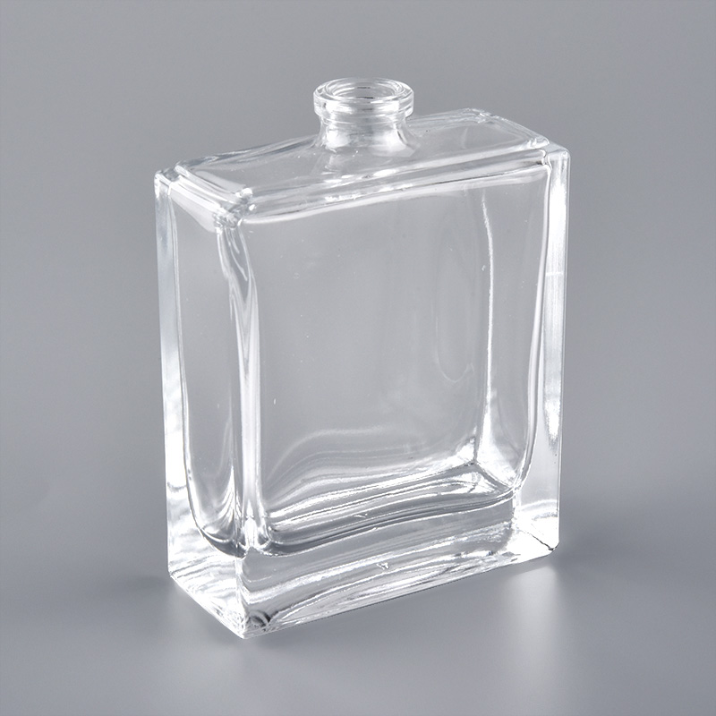 Frasco de perfume de vidrio transparente cuadrado de 2 oz con tapa engarzada