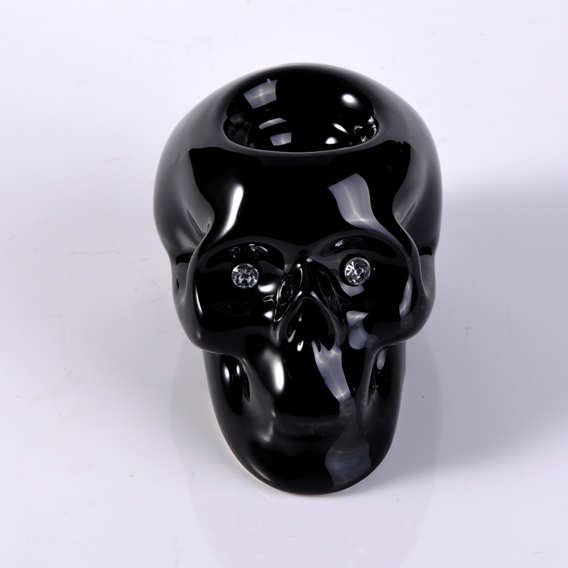 Cráneo negro de té de cerámica titular de la vela ligera para la decoración del hogar