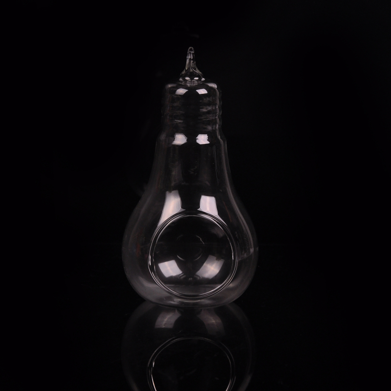 Świecznik ze szkła borokrzemianowego w kształcie świeczki