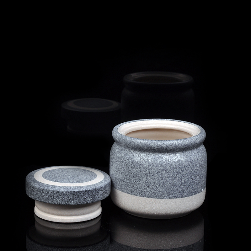 Porta velas de cerámica con acabados en mármol