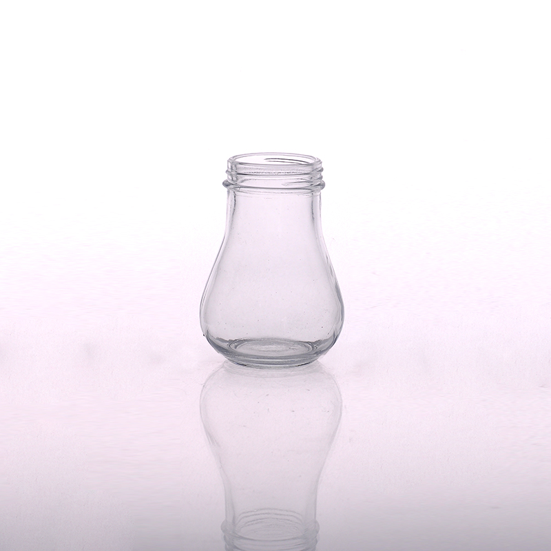 楕円形の缶詰のふた付きのガラス瓶