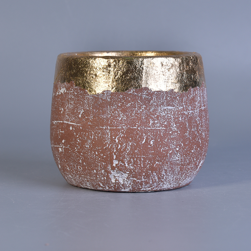 Vaso di candela ceramico in oro con verniciatura a colori
