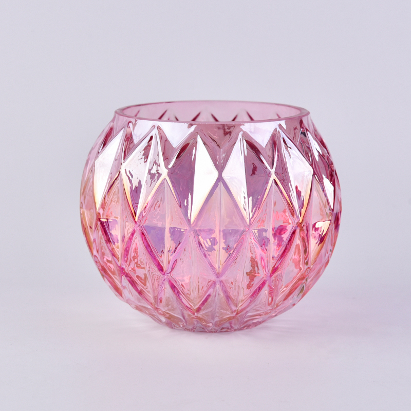 Candelero de cristal iridiscente de la forma de la bola rosada