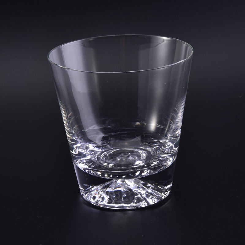 Mouth blown clear votive glass candle cup