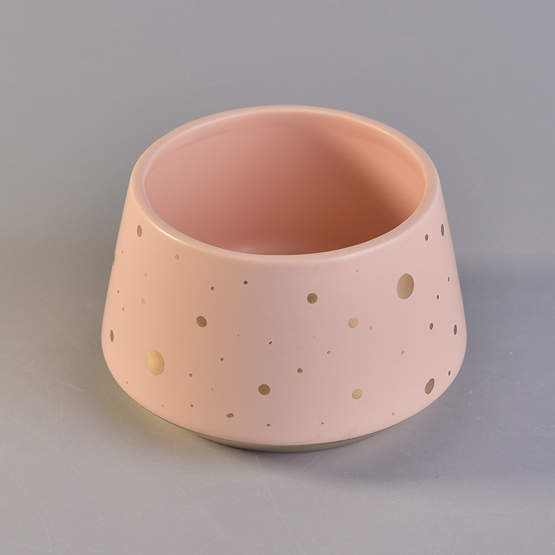 Bacia de vela cerâmica de cor rosa com pontos de ouro