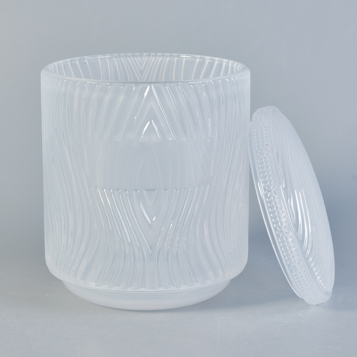 Popularne tłoczone szklane słoiki ze świecami z pokrywkami