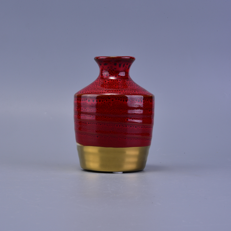 Bougeoir en céramique en couleur rouge et or