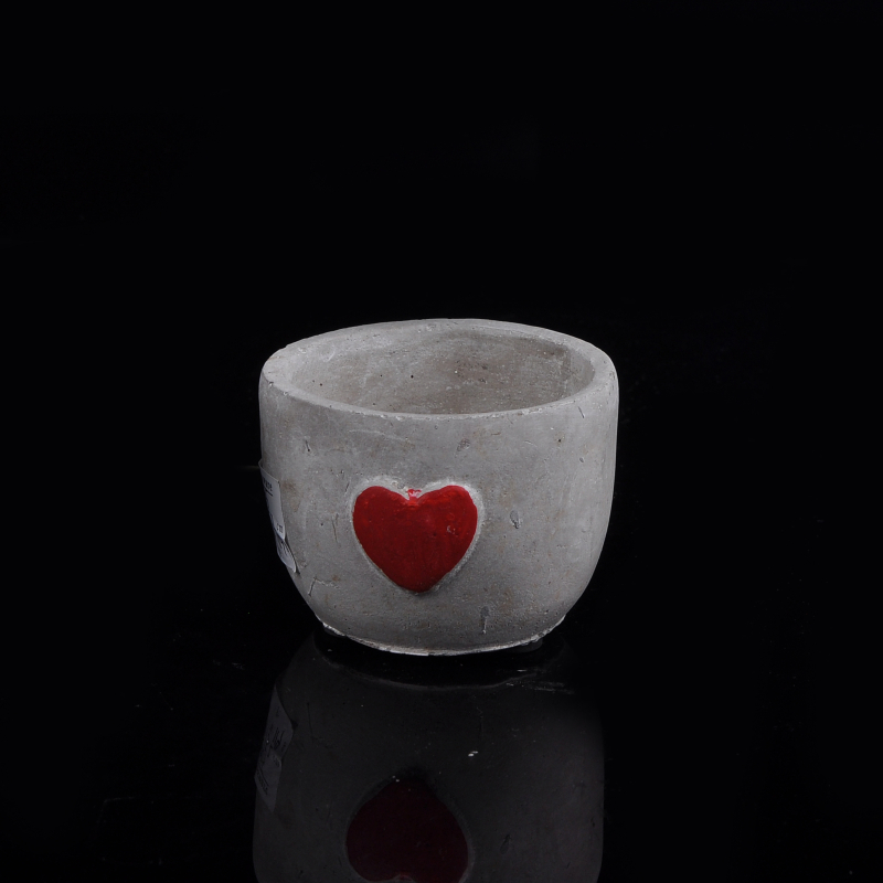 Rotonda forma del contenitore candela calcestruzzo con rilievo cuore