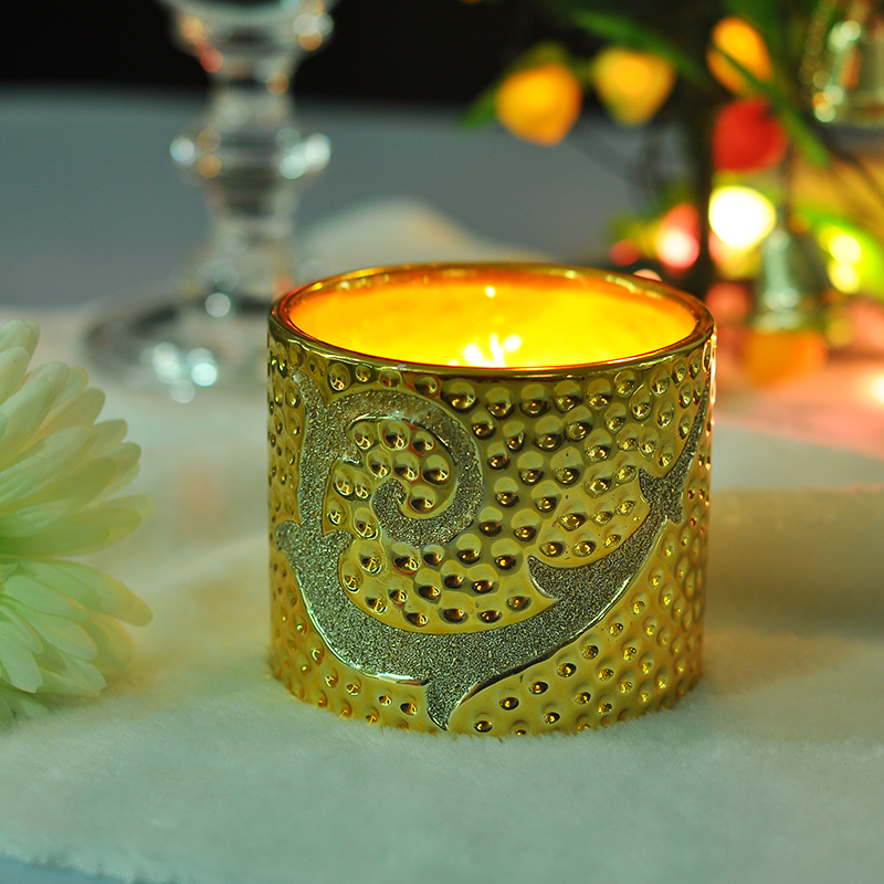 Splendente portacandele in ceramica dorata