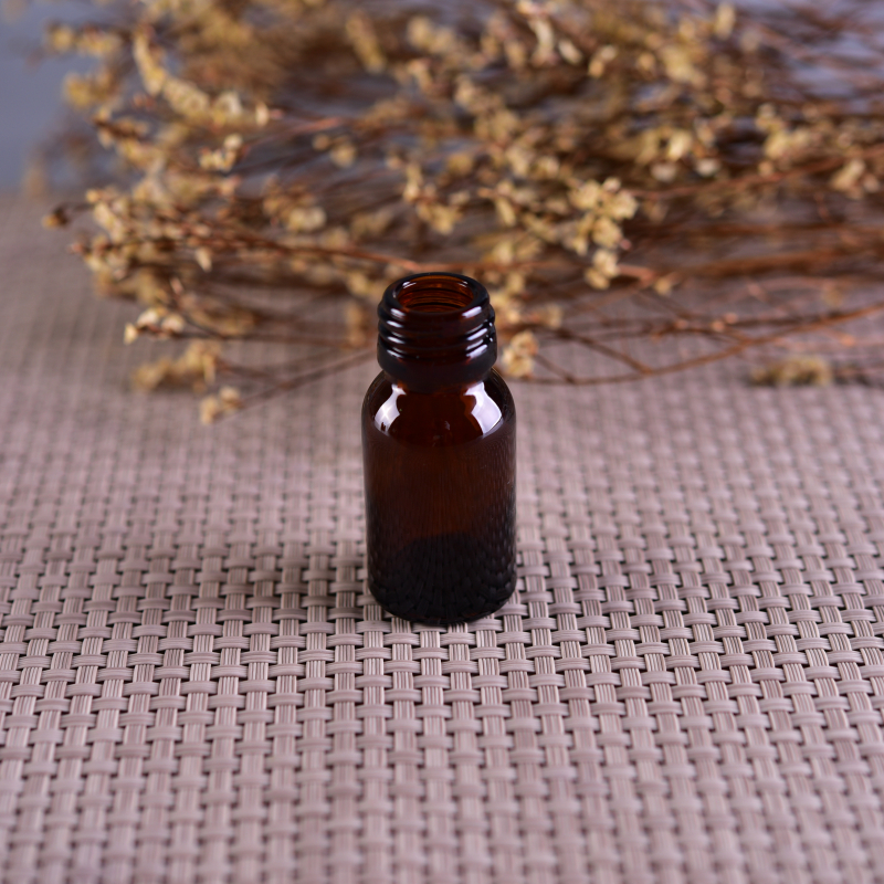 Small screw top amber glass bottle for medicine