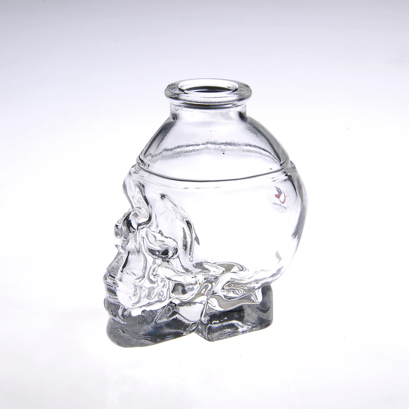 Envase de cristal de pequeño cráneo cabeza botella perfume comestic