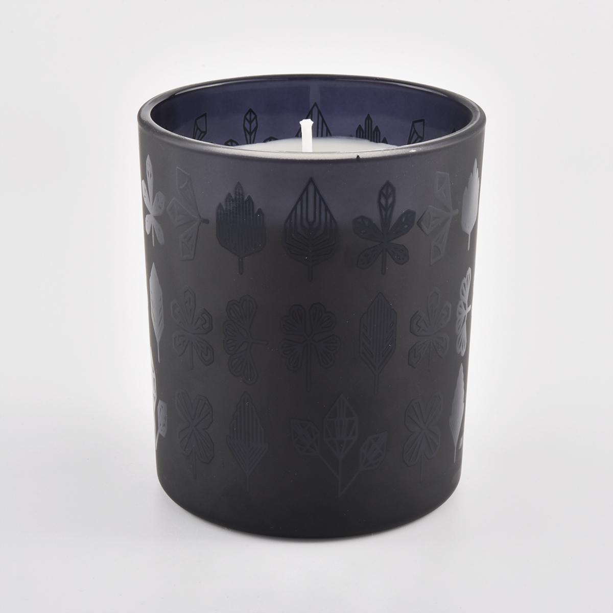 frasco de vela de vidro fosco preto com padrões em relevo