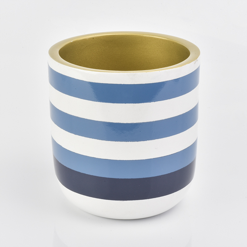 blue and white striped round concrete candle jar