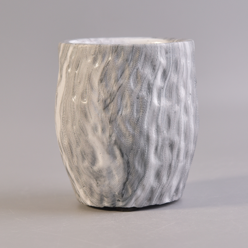 frasco de vela cimento com superfície linha mármore