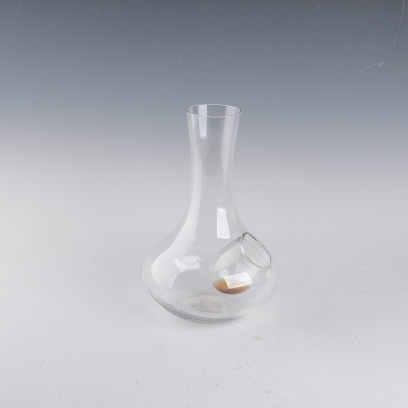 clear glass decanter with ice hole