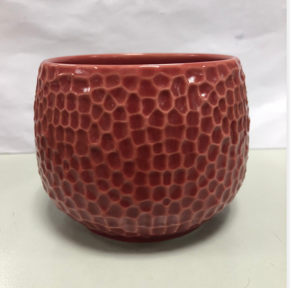 tarro de vela de cerámica con patrón de panal de diferente color