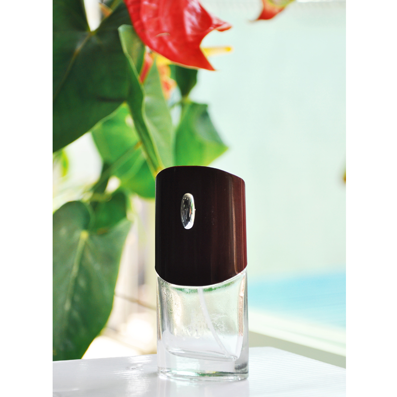 glass perfume bottle with brown lid