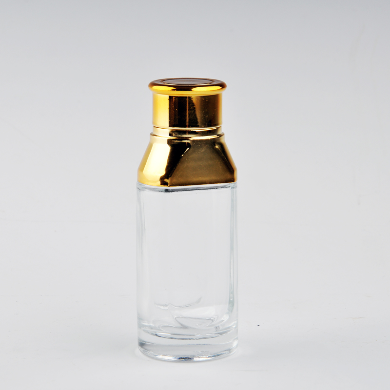 botol minyak wangi kaca dengan penutup emas