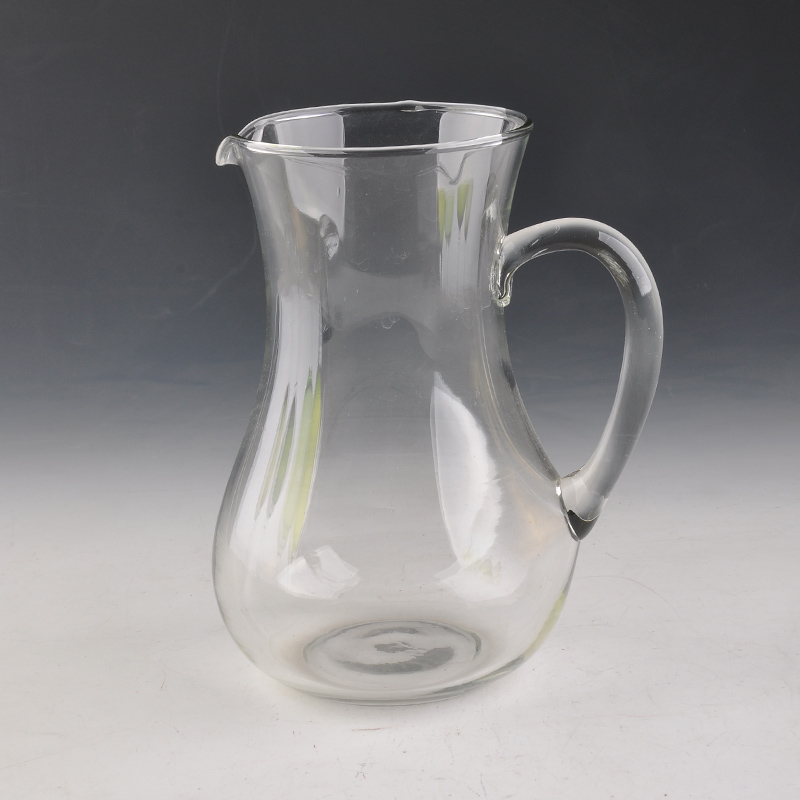 glass water jug with hand