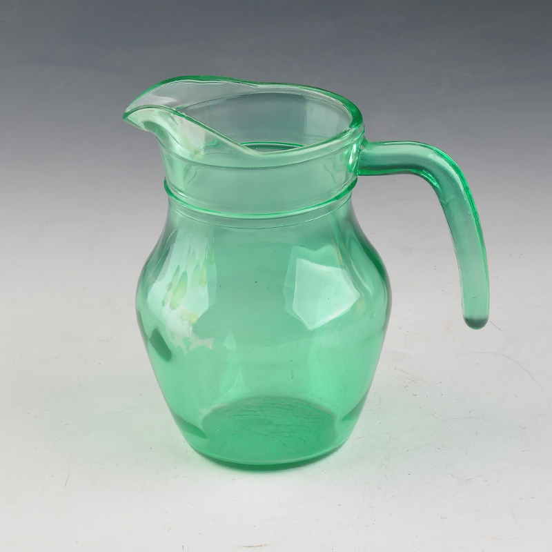 green transparent glass water jug