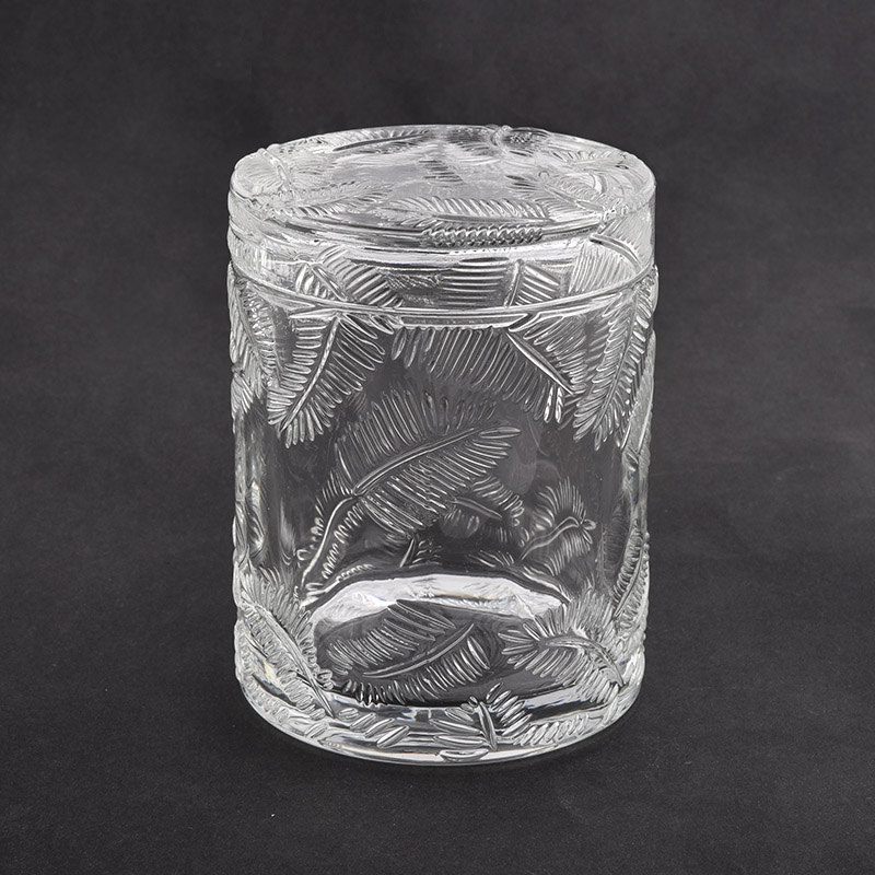 Frascos de vela de vidrio transparente con patrón en relieve de hojas con tapa